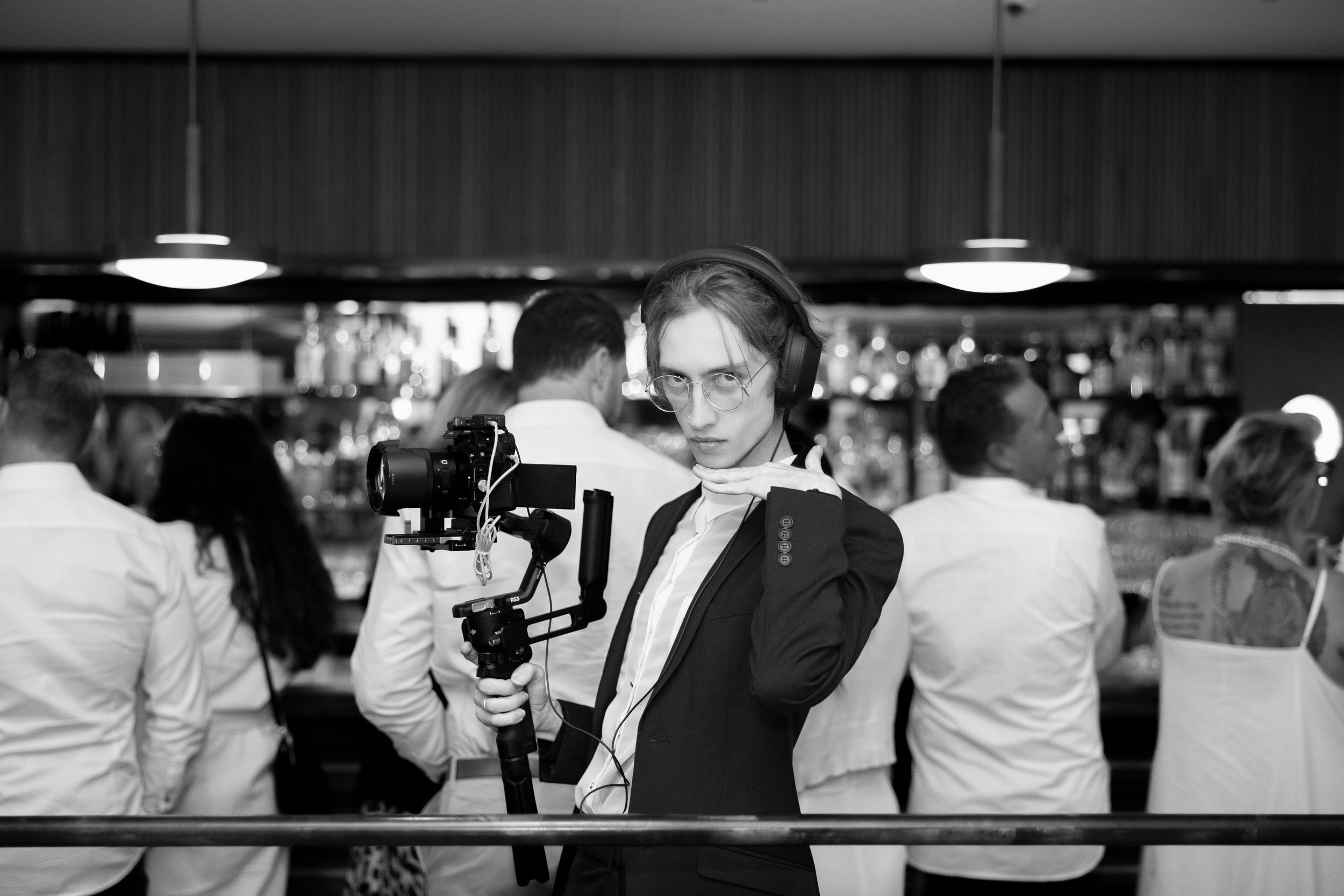 Bradley Sinclair filming with a camera